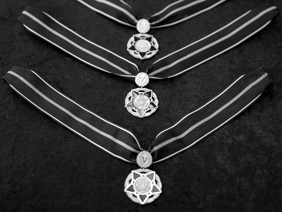 Medals of Valor rest on a table before a ceremony in the Oval Office of the White House on Friday, January 3, 2025, in the Oval Office