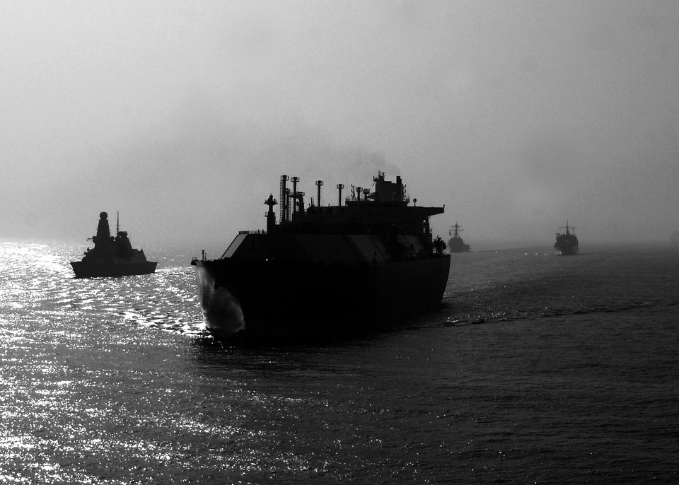 Ships with Combined Task Force 521 conduct convoy escort operations with a large natural gas tanker, foreground, during International Mine Countermeasures Exercise (IMCMEX) 2013 in the Persian Gulf May 21, 2013 130521-N-PV215-046