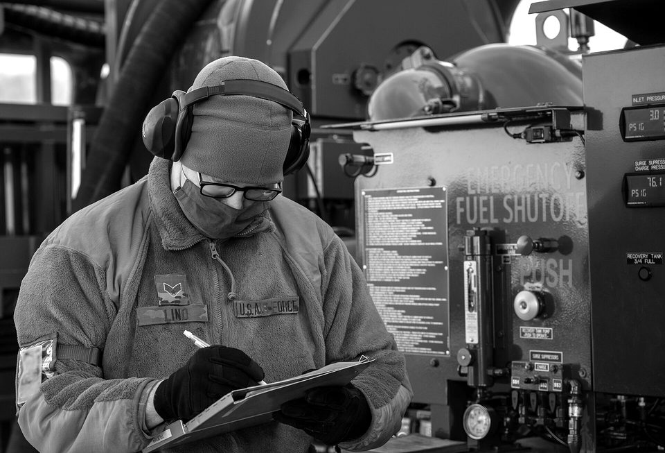 SrA Patrick Lind, 436th Logistics Readiness Squadron fuels journeyman, fills out a fuel receipt while refueling a Royal Australian Air Force C-17 Globemaster III at Dover Air Force Base, Delaware, March 13, 2021