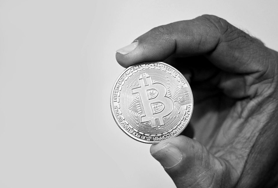 Holding Bitcoin cryptocurrency coin